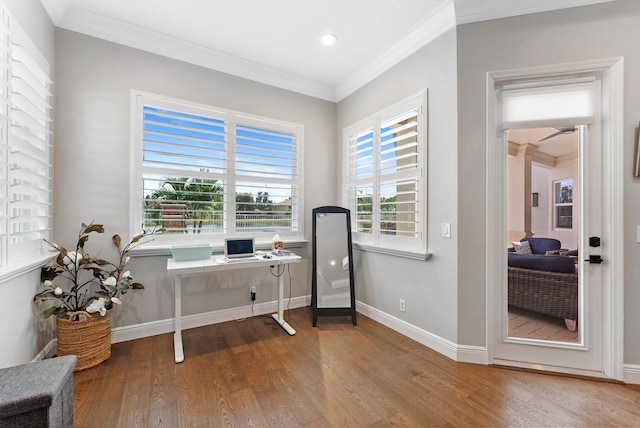 office featuring crown molding, wood finished floors, and baseboards