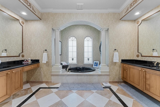 bathroom featuring a sink, ornamental molding, wallpapered walls, and decorative columns