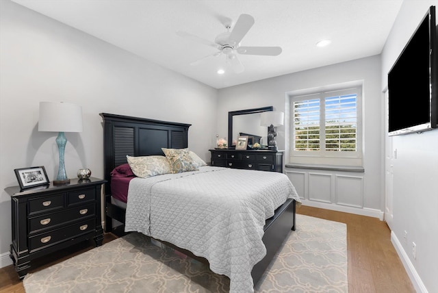 bedroom with recessed lighting, ceiling fan, baseboards, and wood finished floors