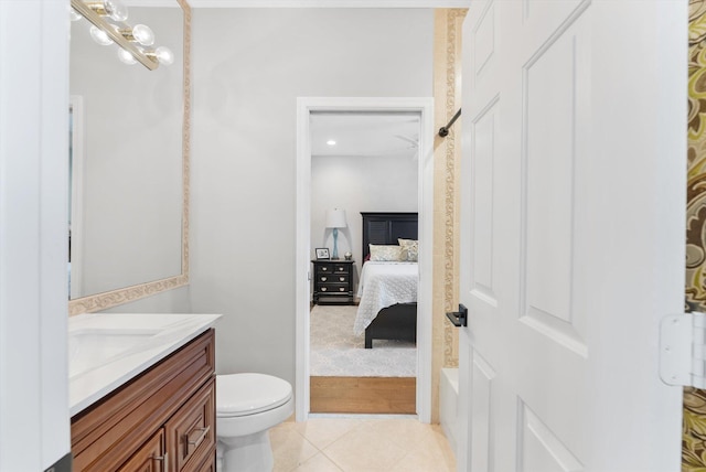 bathroom with tile patterned floors, toilet, ensuite bath, and vanity