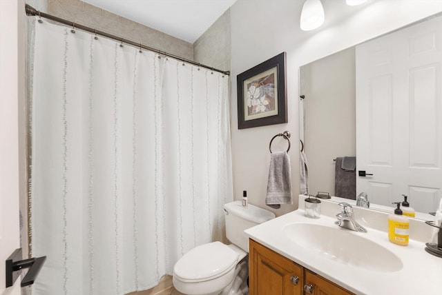 bathroom with a shower with curtain, toilet, and vanity