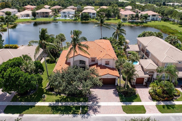 birds eye view of property with a residential view and a water view