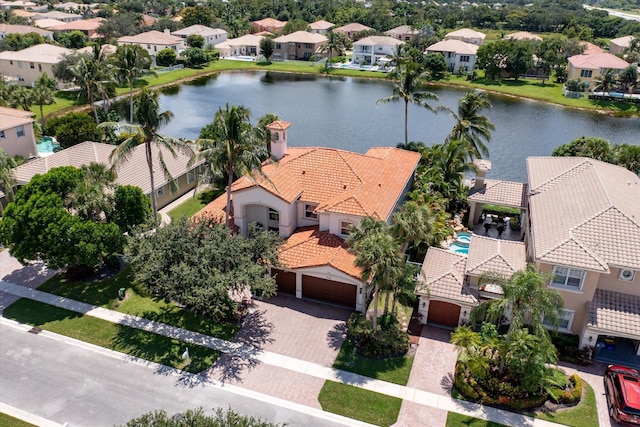 bird's eye view featuring a residential view and a water view