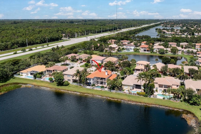 bird's eye view featuring a residential view and a water view