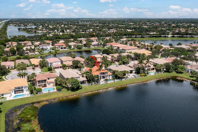 bird's eye view with a residential view and a water view