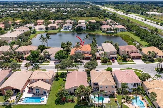 bird's eye view featuring a residential view and a water view