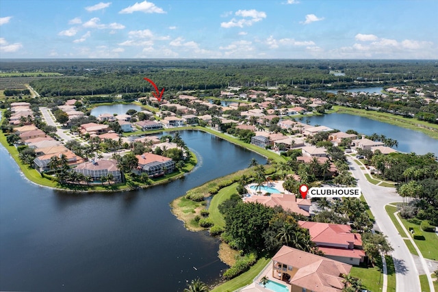 drone / aerial view featuring a residential view and a water view