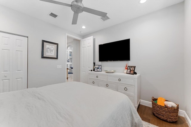 bedroom with recessed lighting, visible vents, baseboards, and wood finished floors