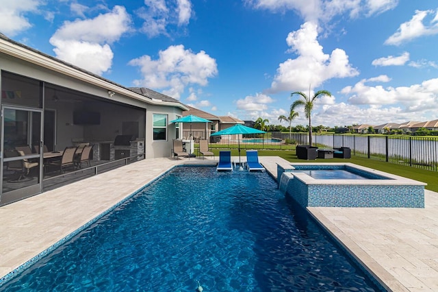 view of swimming pool with a fenced backyard, a pool with connected hot tub, a water view, a patio area, and a lawn