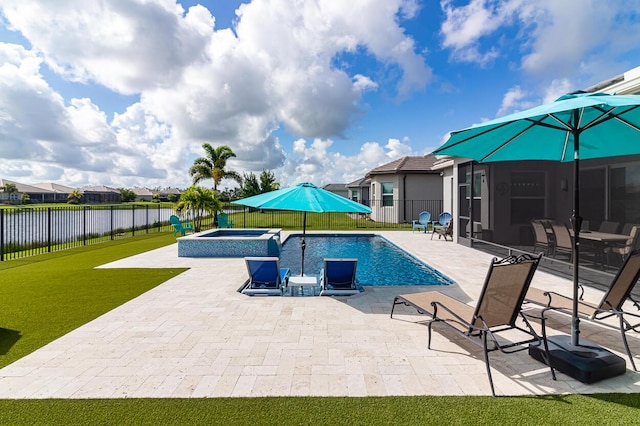 view of swimming pool with a lawn, a pool with connected hot tub, a fenced backyard, and a patio area