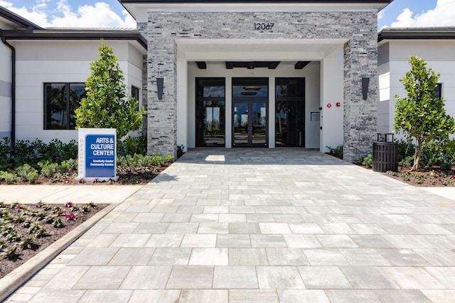 entrance to property featuring french doors