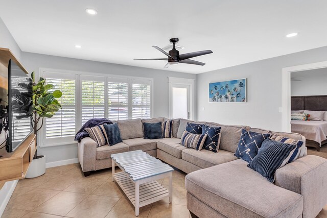 tiled living room featuring ceiling fan