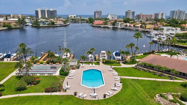 birds eye view of property with a water view