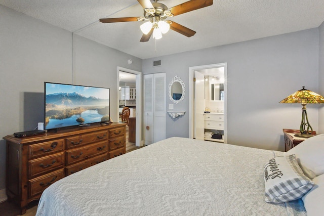 bedroom featuring a textured ceiling, connected bathroom, ceiling fan, and a closet