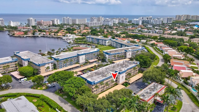 birds eye view of property featuring a water view