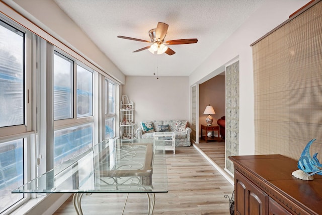 interior space featuring ceiling fan