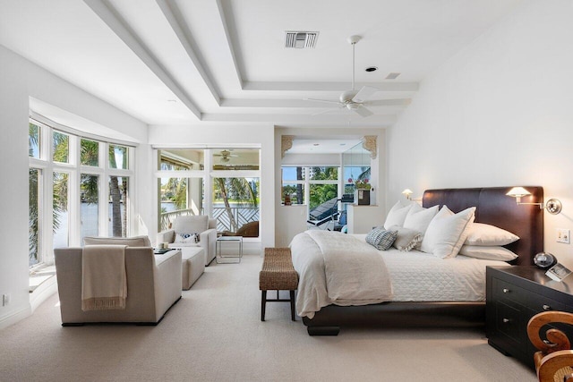 bedroom featuring multiple windows, carpet flooring, and ceiling fan