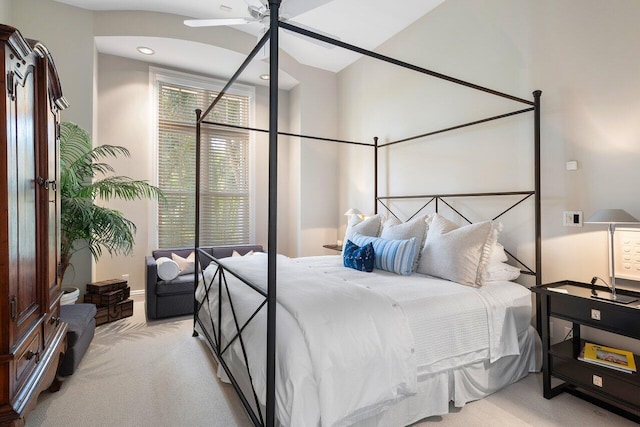 bedroom featuring light colored carpet and ceiling fan