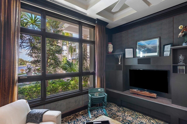 interior space with ornamental molding, coffered ceiling, a healthy amount of sunlight, and ceiling fan