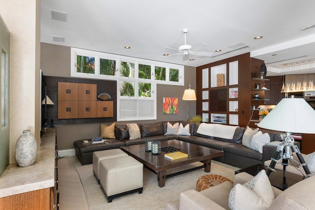 living area featuring ceiling fan, visible vents, and recessed lighting