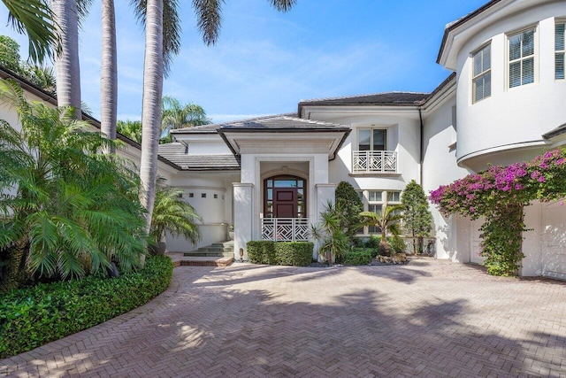 doorway to property with stucco siding