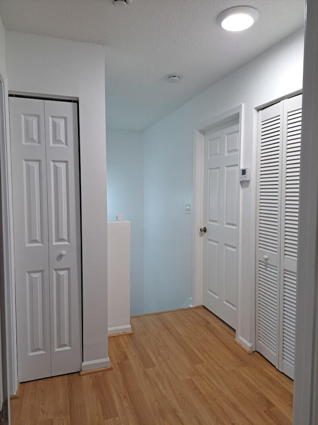 hallway featuring light hardwood / wood-style flooring