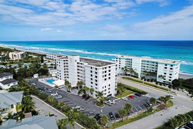 bird's eye view featuring a view of the beach and a water view