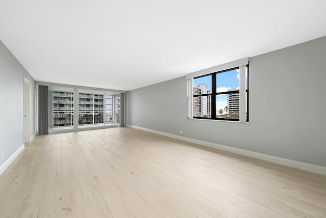 unfurnished room featuring light wood-type flooring