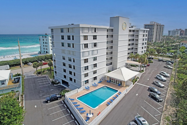 birds eye view of property with a view of the beach and a water view