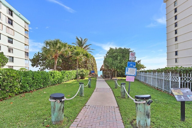 view of home's community with a yard