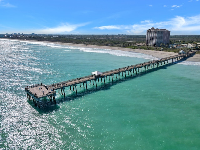 birds eye view of property with a beach view and a water view