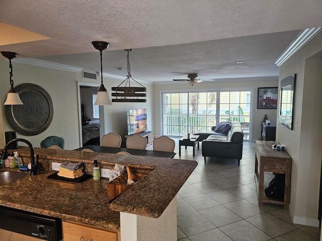 kitchen featuring hanging light fixtures, dishwasher, sink, ceiling fan, and ornamental molding