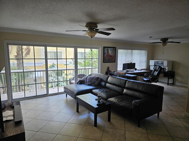 tiled living room with a textured ceiling, crown molding, and ceiling fan