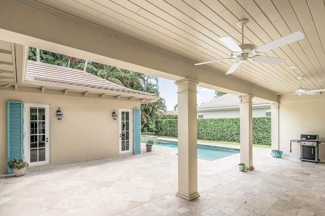 view of patio / terrace featuring a grill, a fenced in pool, and ceiling fan