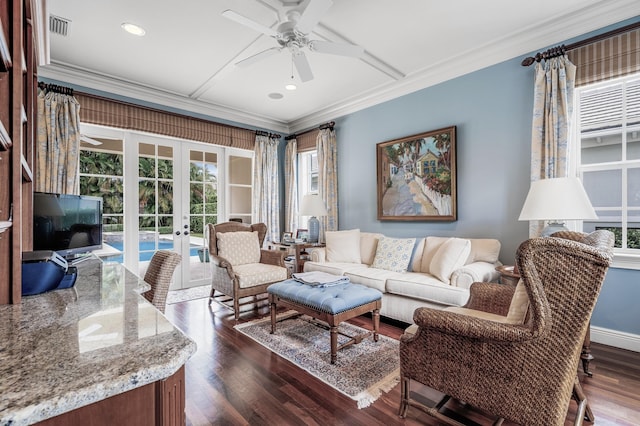 living area featuring dark wood-type flooring, french doors, visible vents, and ornamental molding