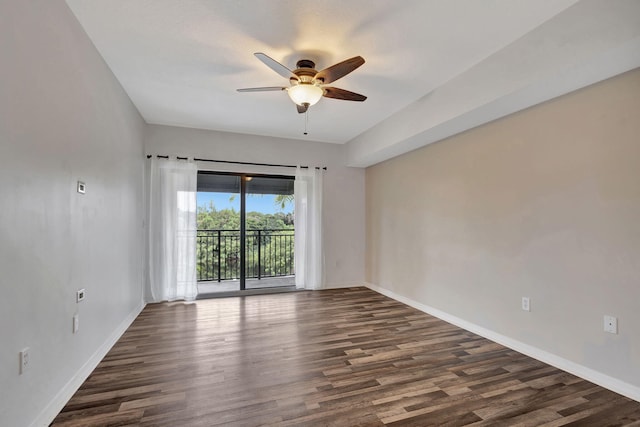 unfurnished room featuring ceiling fan and dark hardwood / wood-style floors