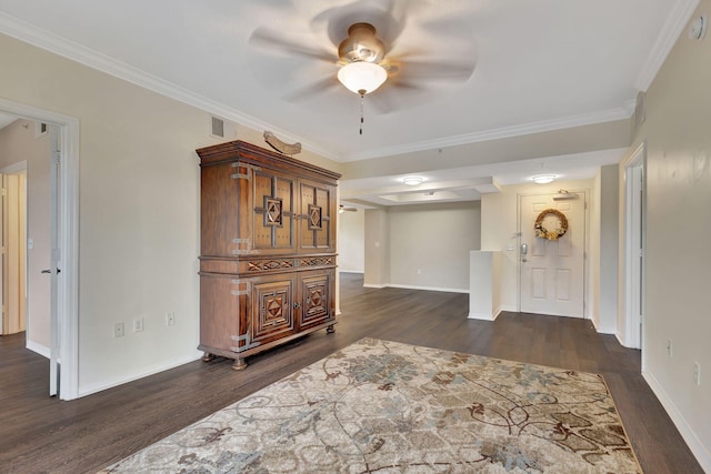 interior space featuring ceiling fan, ornamental molding, and dark hardwood / wood-style flooring