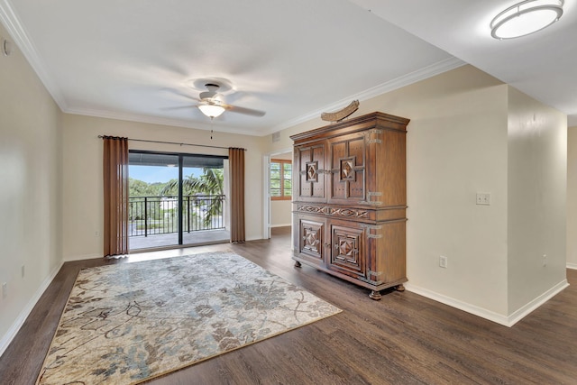 interior space with ceiling fan, dark hardwood / wood-style flooring, and crown molding