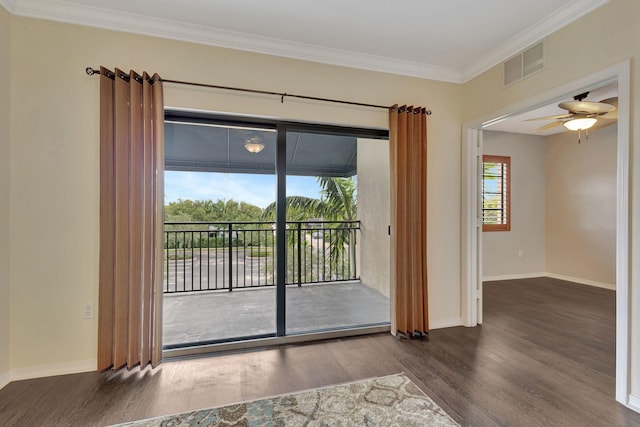 interior space with crown molding, dark hardwood / wood-style flooring, and ceiling fan