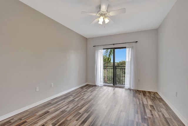 spare room with wood-type flooring and ceiling fan