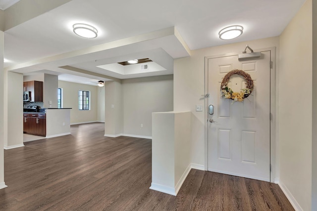 entrance foyer with dark hardwood / wood-style flooring and ceiling fan