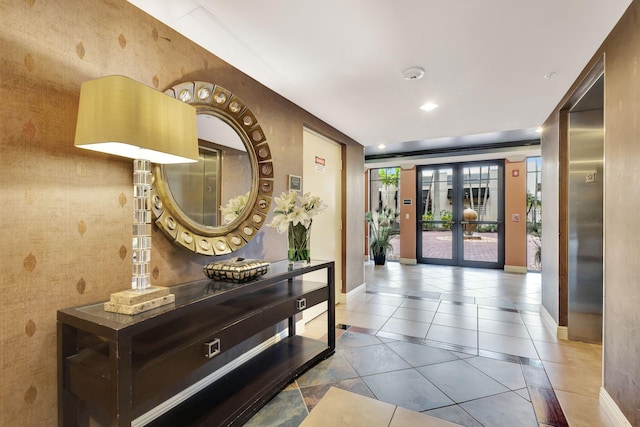 hall with light tile patterned floors and french doors