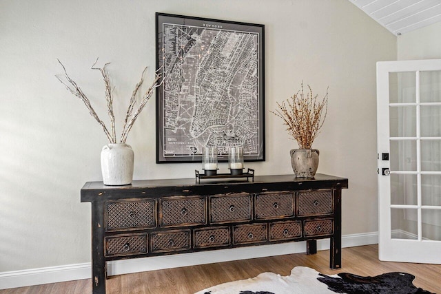 interior details with baseboards and wood finished floors
