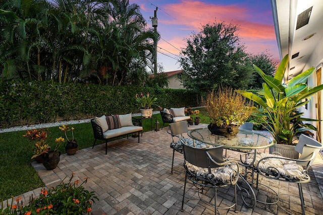 view of patio terrace at dusk