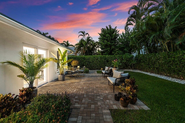 patio terrace at dusk with a lawn