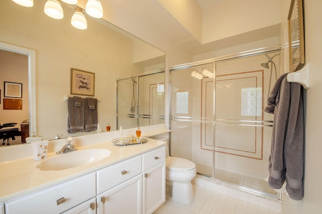 full bathroom with toilet, vanity, a shower stall, and tile patterned floors