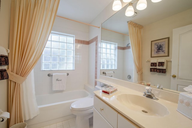 full bath with shower / tub combo with curtain, vanity, toilet, and tile patterned floors