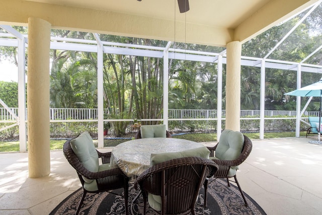 sunroom featuring a ceiling fan