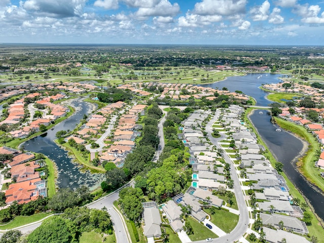 drone / aerial view with a residential view and a water view