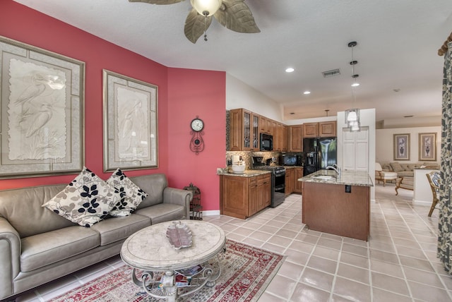 living room with recessed lighting, visible vents, light tile patterned flooring, ceiling fan, and a textured ceiling